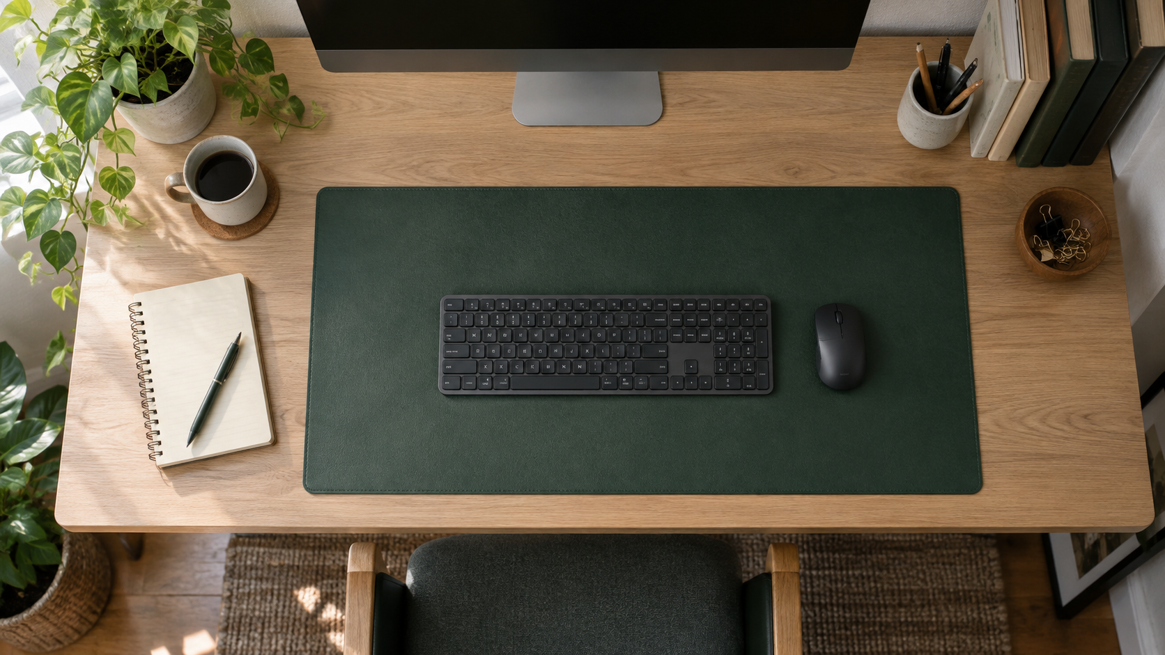 Top-down view of a desk mat with keyboard and mouse leaving clear desk space around it
